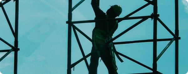 A man constructing scaffolding